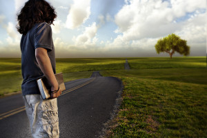 teen looking down road